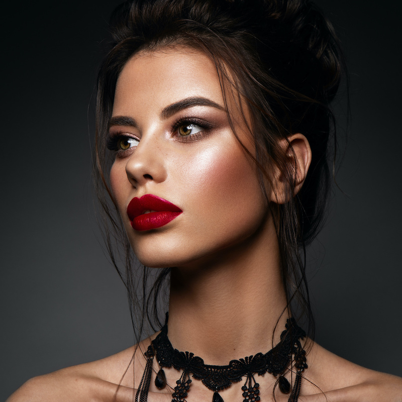neck lift woman with bold red lipstick