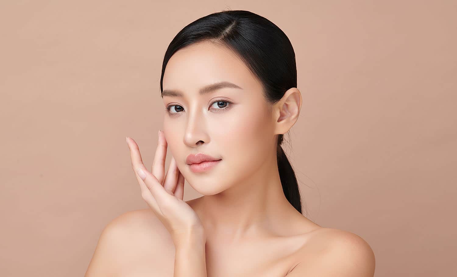 Woman touching her face with clear skin. Woman touching her face with clear skin.